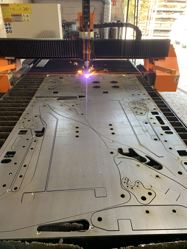 CNC plasma machine cutting multiple nested pieces